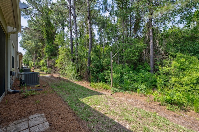 view of yard featuring central AC unit