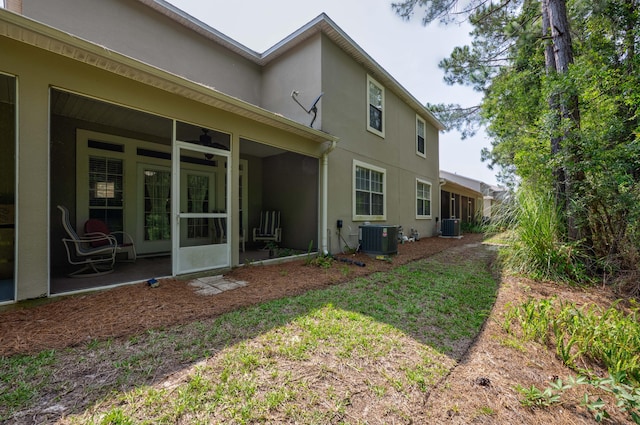 rear view of property featuring central air condition unit