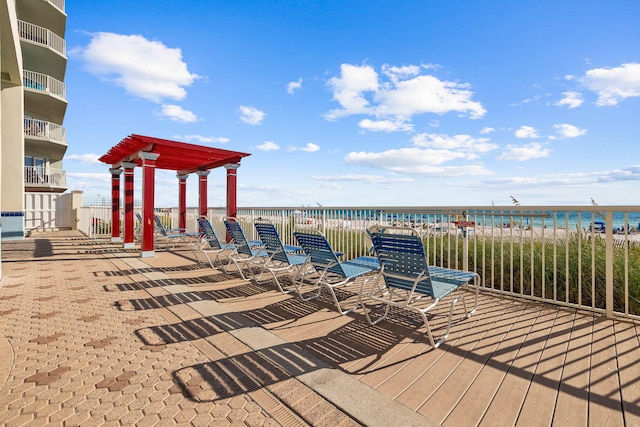 wooden terrace with a water view