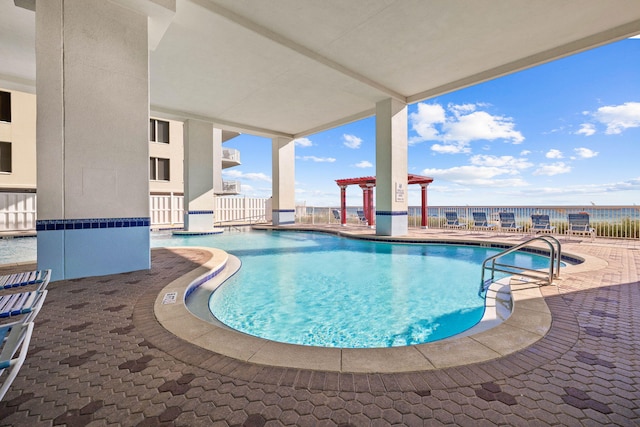 view of swimming pool featuring a patio area