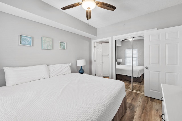 bedroom with ceiling fan and dark hardwood / wood-style floors