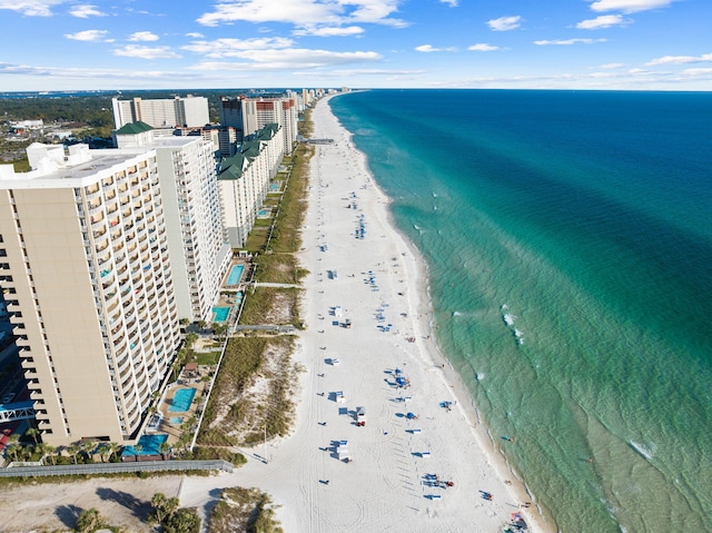 birds eye view of property with a beach view and a water view