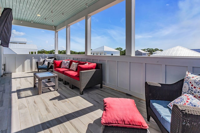 wooden deck featuring outdoor lounge area