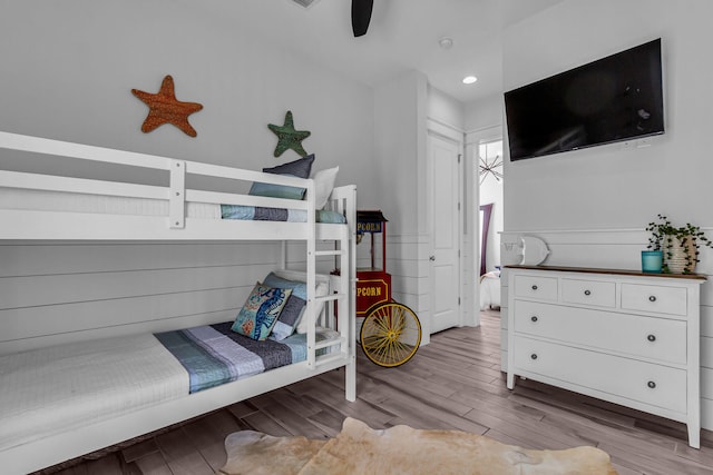 bedroom featuring ceiling fan and hardwood / wood-style flooring