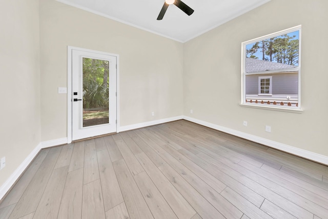 unfurnished room featuring light hardwood / wood-style flooring, ceiling fan, and ornamental molding