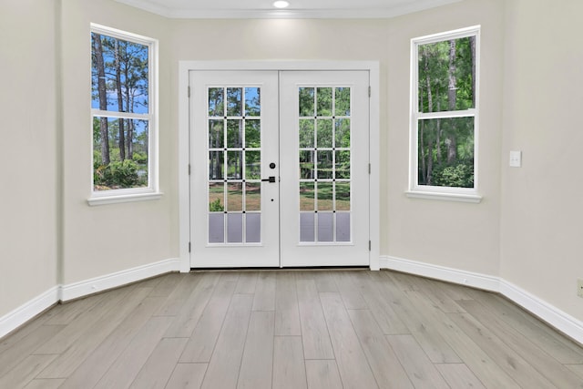 doorway featuring light hardwood / wood-style flooring, french doors, and plenty of natural light