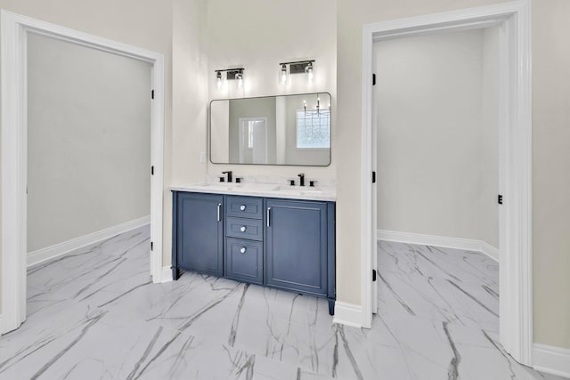 bathroom featuring tile floors, vanity with extensive cabinet space, and dual sinks