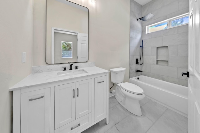 full bathroom featuring oversized vanity, tiled shower / bath, toilet, and tile flooring