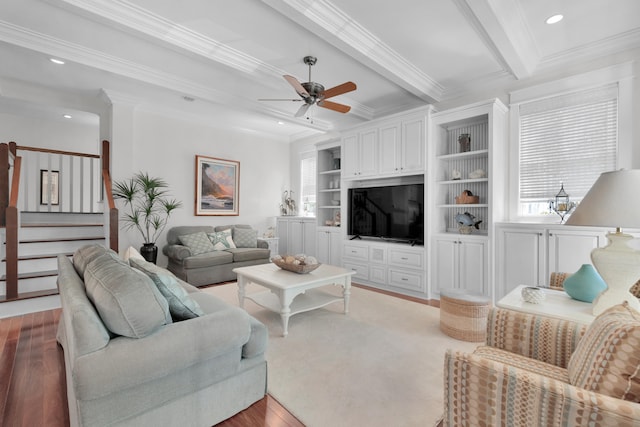 living room with beamed ceiling, ceiling fan, crown molding, and hardwood / wood-style flooring