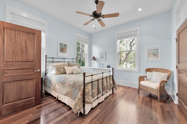 bedroom featuring dark hardwood / wood-style flooring and ceiling fan