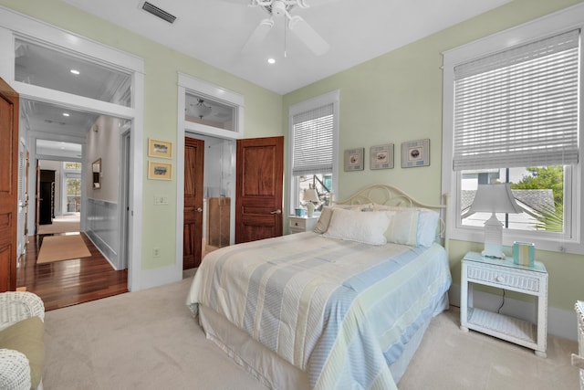 bedroom with ceiling fan and carpet floors