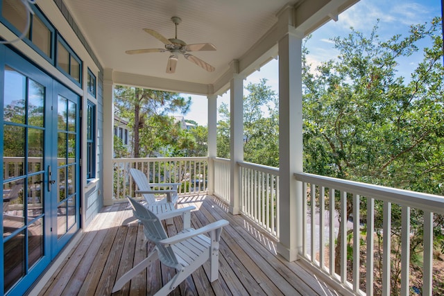 wooden terrace featuring ceiling fan