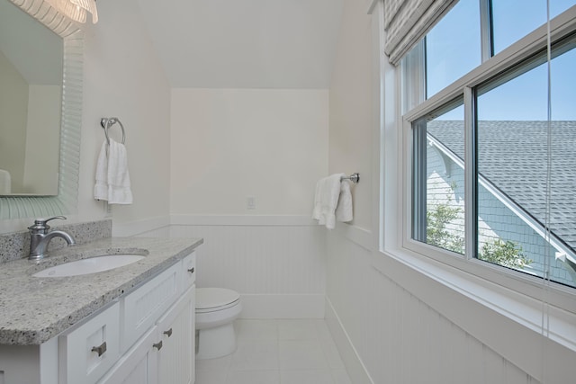 bathroom featuring tile flooring, oversized vanity, and toilet