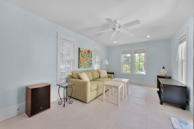 tiled living room featuring ceiling fan