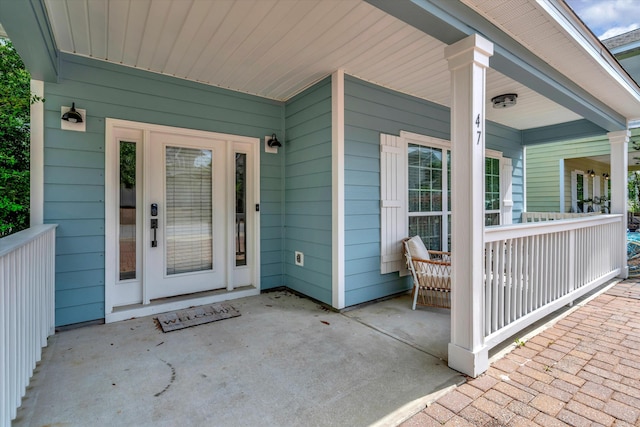 property entrance with covered porch