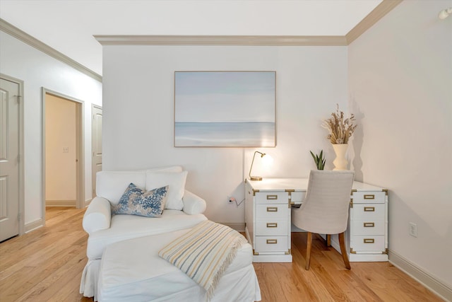 bedroom with light wood-type flooring and ornamental molding