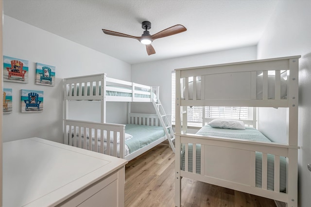 bedroom featuring light hardwood / wood-style flooring and ceiling fan