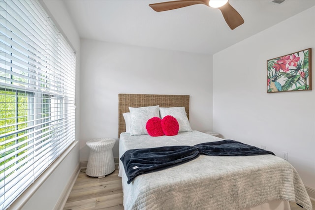 bedroom featuring ceiling fan and light wood-type flooring