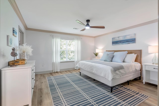 bedroom featuring ceiling fan, light wood-type flooring, and ornamental molding