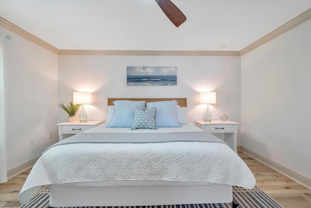 bedroom featuring ceiling fan, light hardwood / wood-style floors, and ornamental molding