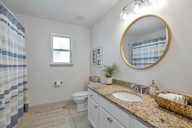 bathroom with vanity with extensive cabinet space, toilet, and tile flooring