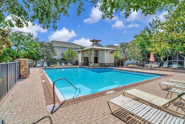 view of swimming pool with a patio area