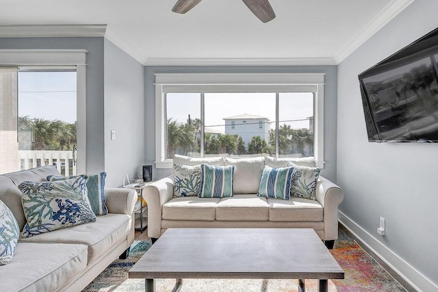 living room with ceiling fan and crown molding