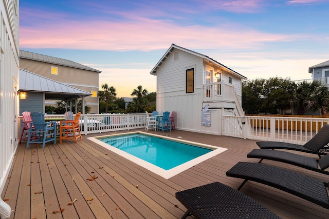 view of pool with a deck and a fenced in pool