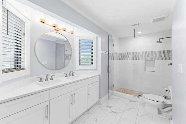 full bath with marble finish floor, visible vents, a sink, and a shower stall