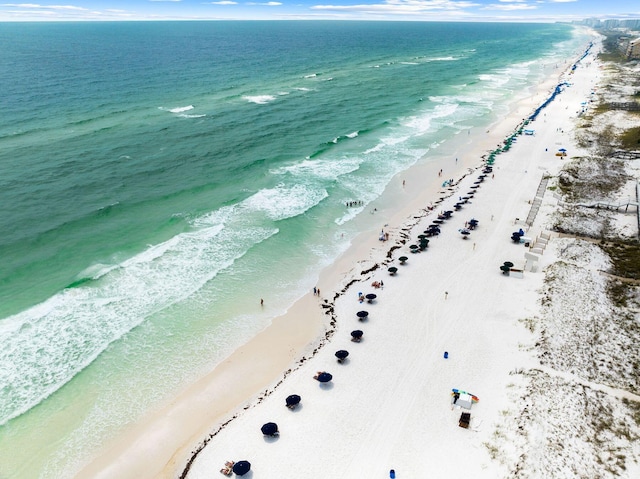 aerial view with a water view and a view of the beach