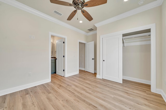 unfurnished bedroom featuring ceiling fan, a closet, ornamental molding, and light wood-type flooring