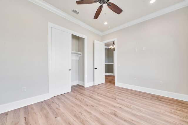 unfurnished bedroom with ceiling fan, a closet, crown molding, and light hardwood / wood-style flooring