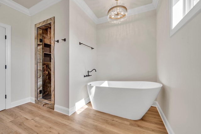 bathroom with a chandelier, wood-type flooring, independent shower and bath, and ornamental molding