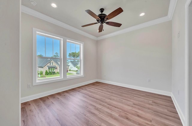 empty room with ceiling fan, light hardwood / wood-style floors, and ornamental molding