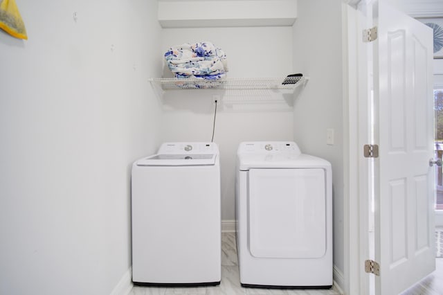 laundry room with washer and dryer