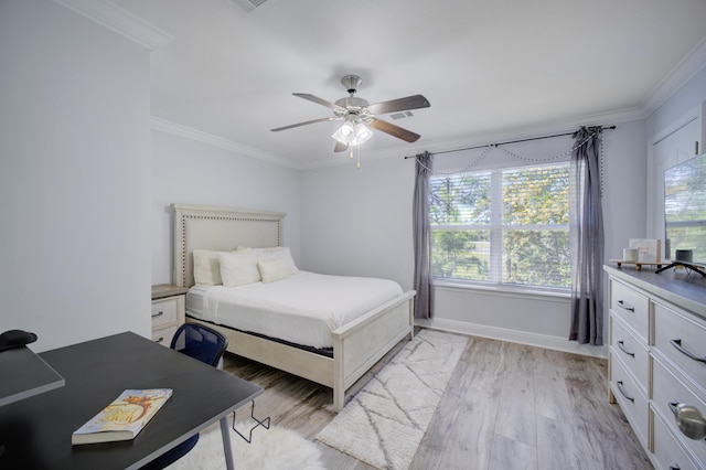 bedroom with ceiling fan, crown molding, and light wood-type flooring