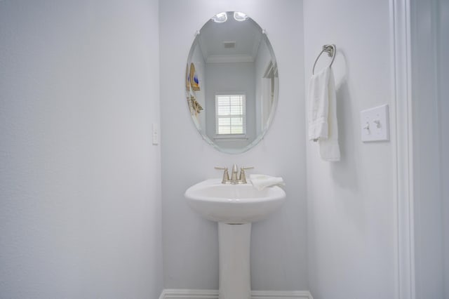 bathroom with crown molding