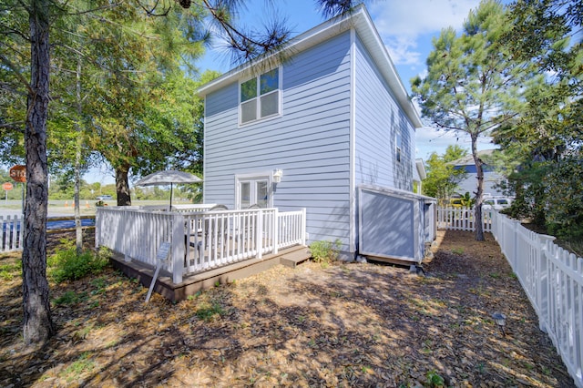 rear view of property with a deck