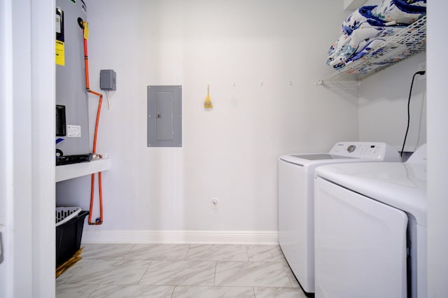 laundry room featuring independent washer and dryer, electric water heater, and light tile floors