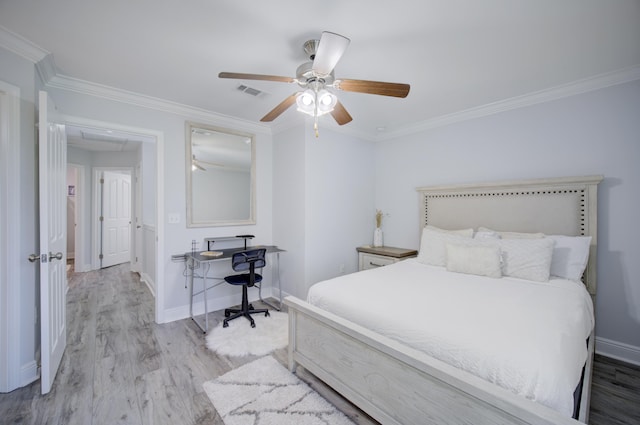 bedroom with light hardwood / wood-style flooring, ceiling fan, and ornamental molding