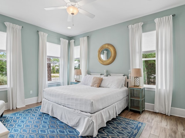 bedroom featuring wood-type flooring and ceiling fan