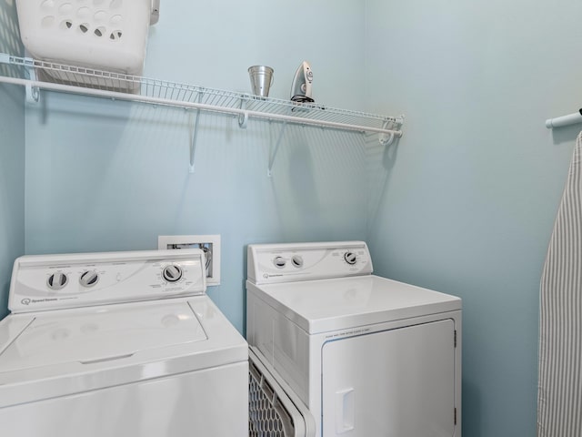 laundry area featuring washer hookup and washing machine and clothes dryer