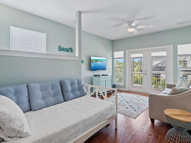 bedroom featuring ceiling fan, french doors, dark wood-type flooring, and access to exterior