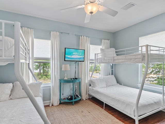 bedroom featuring wood-type flooring and ceiling fan