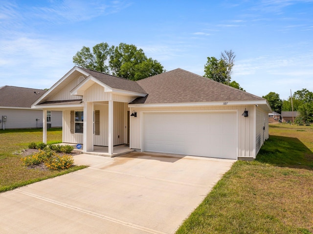 ranch-style house with a garage and a front lawn