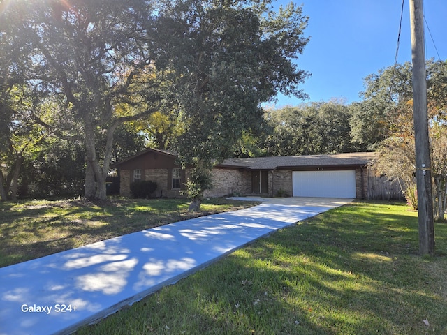 ranch-style house with a garage and a front yard