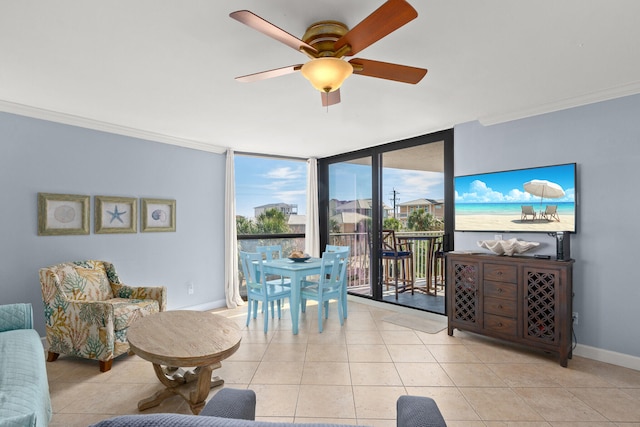 tiled living room featuring ceiling fan, floor to ceiling windows, and ornamental molding