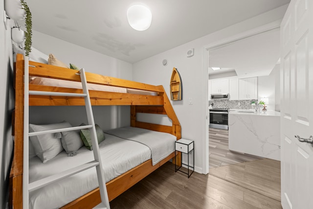 bedroom featuring wood-type flooring