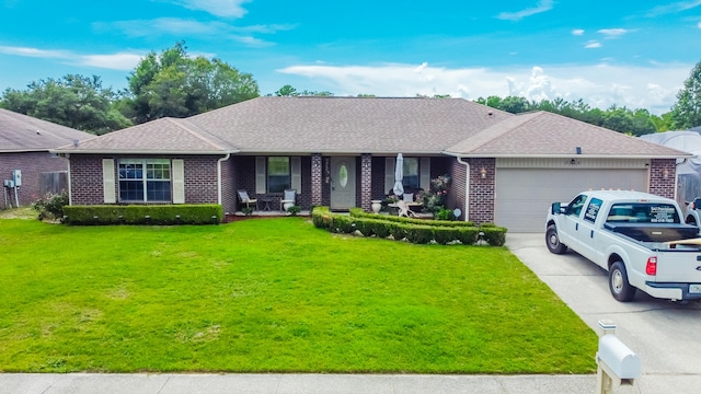 ranch-style home featuring a garage, a front yard, brick siding, a porch, and driveway