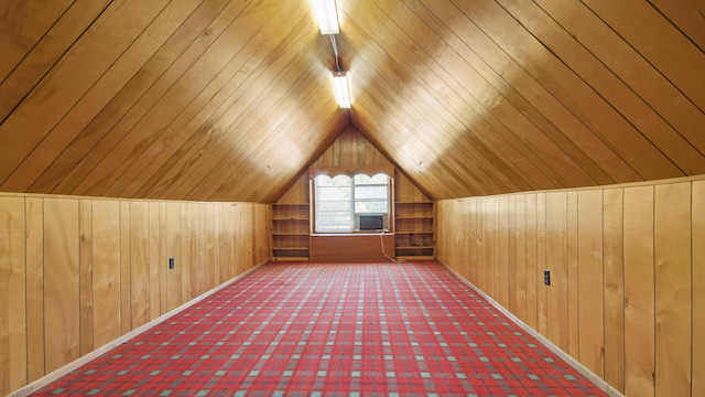 bonus room featuring wooden ceiling, vaulted ceiling, and wood walls